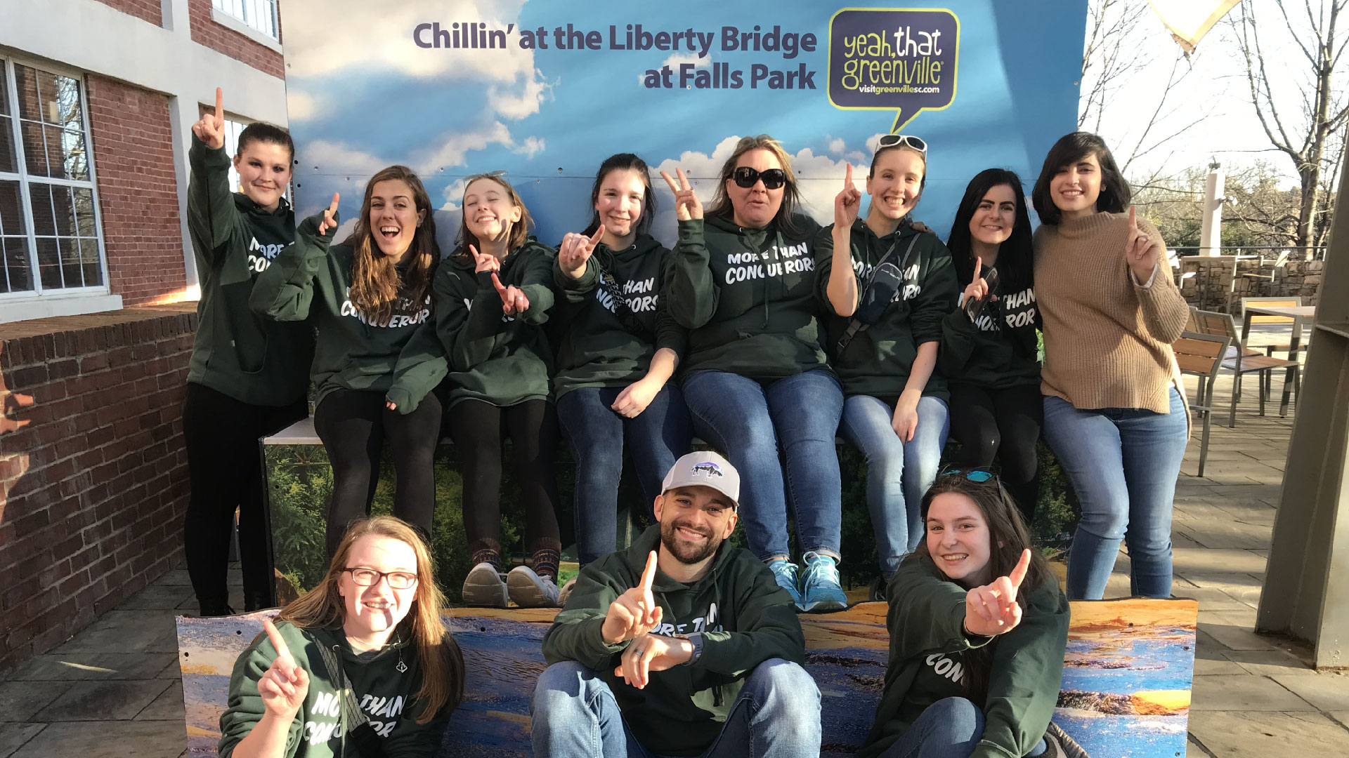 A group of high schoolers from Brookwood Church posing for a picture in downtown Greenville